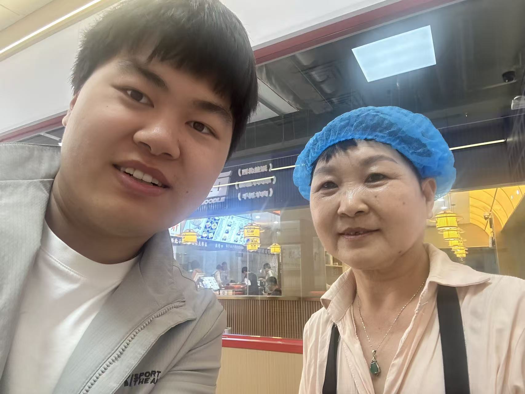 Photo with the restaurant owner inside the shop