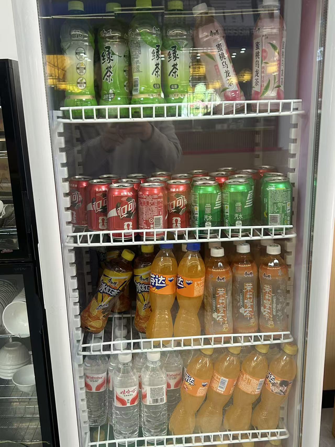 Refrigerator with tea, soda, water, and bottled drinks